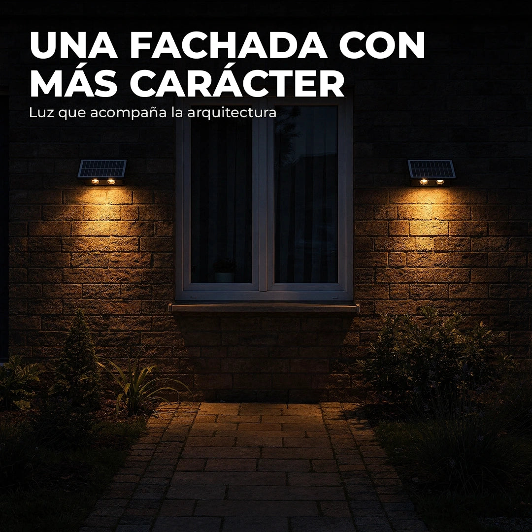 Fachada iluminada con apliques solares negros de doble haz