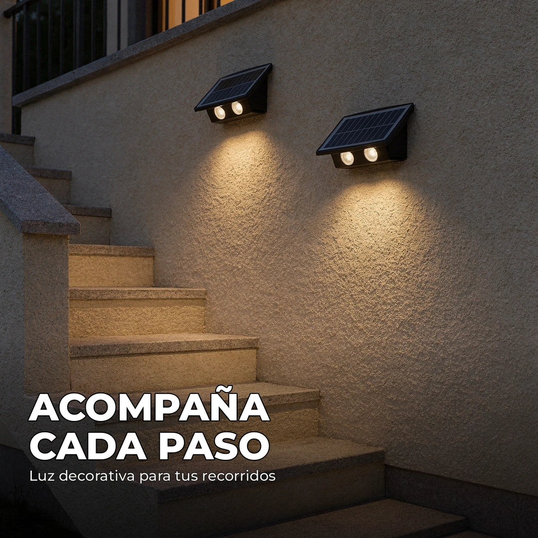 Camino exterior acompañado por iluminación de apliques solares